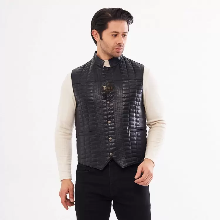 Real black diamond-quilted lambskin leather men's vest being worn over a light-colored sweater