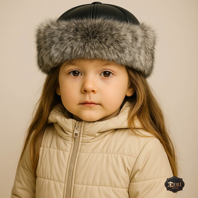 Girls’ Winter Leather Hat – Grey Wolf Fur Trim Girls’ winter hat with grey wolf fur trim and black lamb leather top – lined with sheepskin fleece