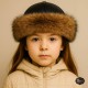 Girls’ Faux Fur Sheepskin Hat – Winter Leather Cap Girls’ winter hat with black lamb leather top, faux wolf fur trim, and natural sheepskin lining